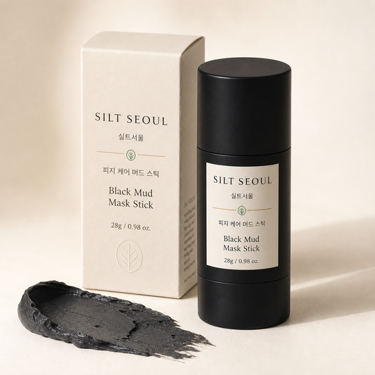 SILT SEOUL Black Mud Mask Stick product packshot with tube, carton, and clay texture
